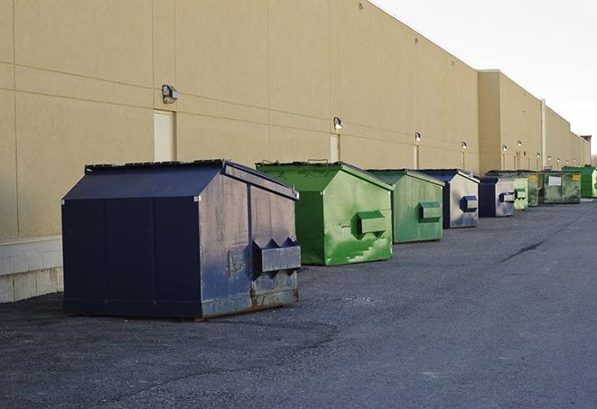 a stack of heavy construction dumpsters waiting to be emptied in Arvin, CA